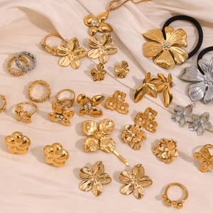 Floral 18K gold and silver jewelry set with pearls and rhinestones on silk fabric