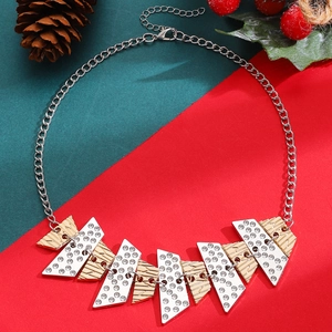 Macro shot of geometric Christmas tree earrings with gold and silver crystal panels