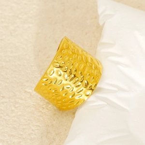 Golden titanium steel wide ring featuring unique hammered texture and polished metal finish