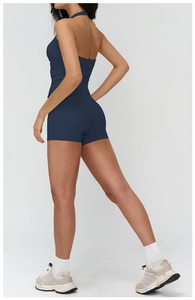 Detail of navy blue halter top and high-waisted shorts with hollow back athletic design