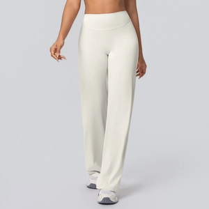 Detail of high-waisted flared yoga pants in cream white with soft brushed texture