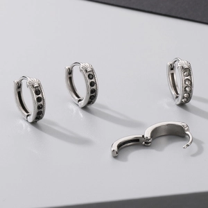 Crossed heart hoop earrings in vintage silver with black and white zircon stones