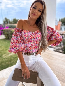 Detail of floral off-the-shoulder top with puff sleeves and corset structure bodice
