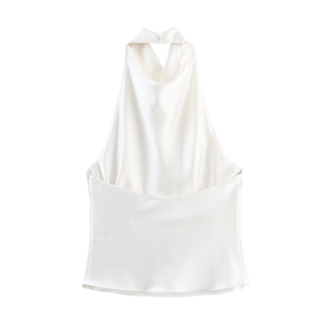Detailed view of the smooth white satin fabric and halter neckline of the fashion top