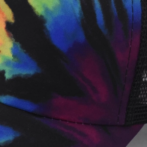 Detailed close-up of vibrant tie-dye pattern and breathable black mesh fabric on a baseball cap