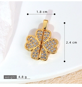 Macro shot of gold clover pendant with zircon pavé showing 1.8cm width and 2.4cm height details