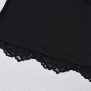 Close-up of intricate black floral lace trim on a backless halter top hemline