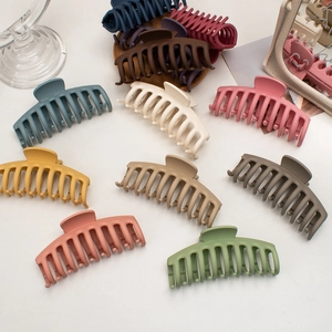 Matte finish large shark hair clips for women in various colors shown on a white background