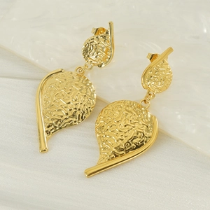 Vintage style gold irregular leaf drop earrings with rippled texture and metallic finish