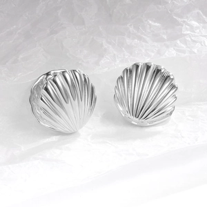 French retro minimalist silver shell shaped earrings with metallic glossy finish