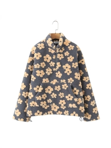 Detail of fleece pullover with yellow floral print, half-zip collar and kangaroo pocket