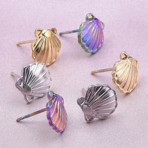 Detailed view of 304 stainless steel seashell stud earrings in gold, silver, and purple