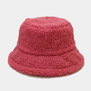 Detail of soft thick faux lamb wool texture on rose pink winter bucket hat