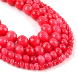 Macro view of faceted red natural stone beads with fine cut texture and gradient sizes