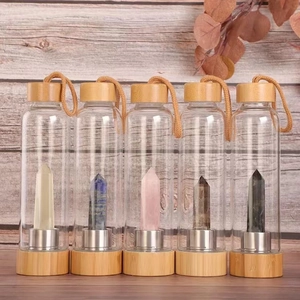 Bamboo lid glass bottles featuring five colorful natural hexagonal crystal pillars inside