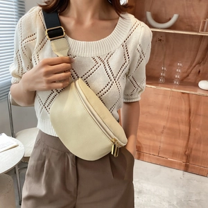 Chic beige lychee leather chest bag with dual gold zippers and wide black strap