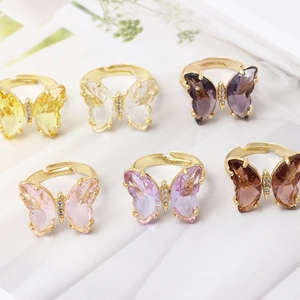 Elegant gold butterfly ring set with colorful crystals and adjustable open band design