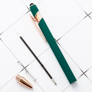 Deep green retractable aluminum ballpoint pen with rose gold trim and internal components