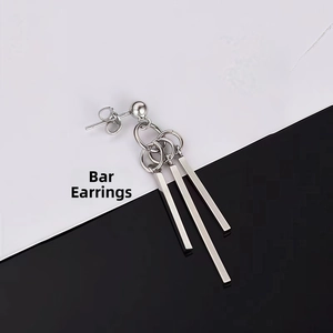 Detail view of silver titanium square bar pendants on minimalist geometric drop earrings