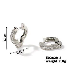 Detail view of silver heart earrings with dimensions 1.7x1.9cm and 2.8g weight specs