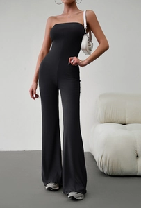 Elegant black strapless ribbed jumpsuit with wide leg flared pants on a model