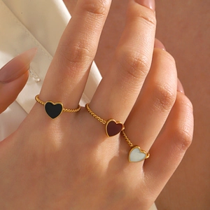 Three-piece heart charm rings with colorful enamel on golden twisted stainless steel bands