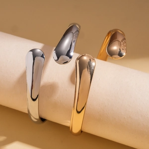 Minimalist polished drop-end open cuff bracelets in gold and silver finishes