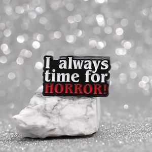 Gothic rectangular enamel pin with I always time for HORROR text on a white rock