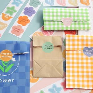 Cartoon dog round waterproof stickers and checkered paper bags for gift packaging