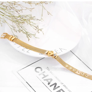 Golden stainless steel mesh bracelet with heart and zircon charms for women