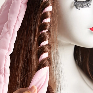 Pink heatless octopus hair curler with quilted fabric texture on brown hair