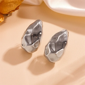 Minimalist silver hammer textured irregular metal stud earrings with high mirror polish