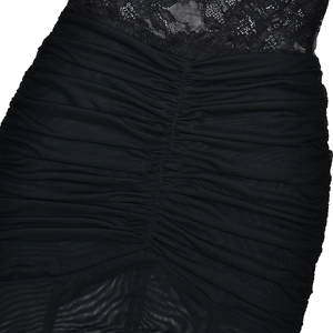 Detailed view of black lace and ruched mesh fabric on a sexy slim fit summer dress