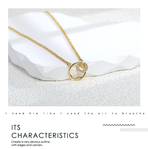 Detailed view of interconnected gold interlocking rings with sparkling pavé zircon stones