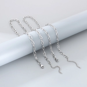 Minimalist silver stainless steel chain necklaces in various link styles and textures