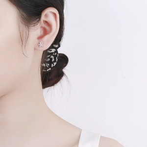 925 silver flower stud earrings with sparkling zircon for women shown on model