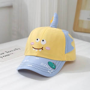 Detail of cartoon dinosaur baseball cap with colorful embroidery and 3D fin accents