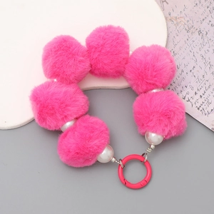 Handmade pink plush ball and white pearl beaded phone wristlet strap with metal ring