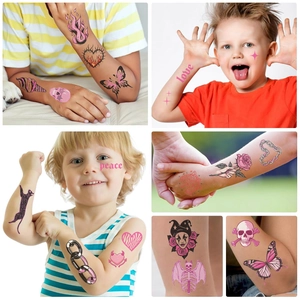 Detail view of colorful skull and rose waterproof temporary tattoos for kids party