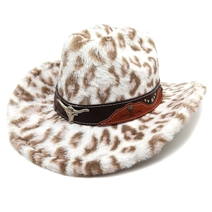 Detailed macro view of leopard print cowboy hat with bull head metal emblem and rivets