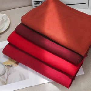 Thick solid color faux cashmere scarves in shades of red for winter warmth and style
