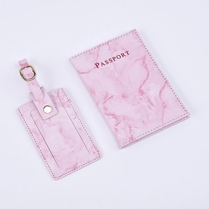 Pink marble textured PU leather passport holder and luggage tag set on white background
