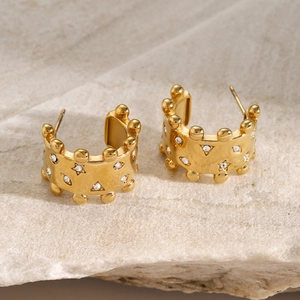 Detail of 18k gold plated stainless steel stud earrings with white crystal crown edge