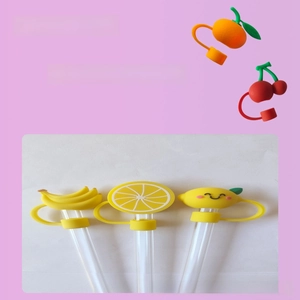 Detailed close-up of fruit-shaped silicone straw covers with integrated dust protection rings