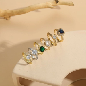 Detailed close-up of luxury 14K gold plated zircon rings in various shapes and colors
