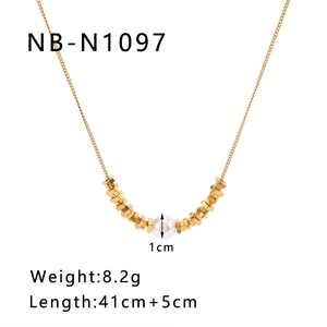 Detail view of gold cube beads and 1cm faux pearl on a delicate stainless steel chain