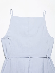 Detail of light blue sleeveless top with square neck and integrated waist belt loops