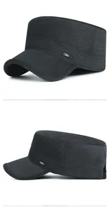 Detail view of the sport metal badge and textured fabric on black military flat cap