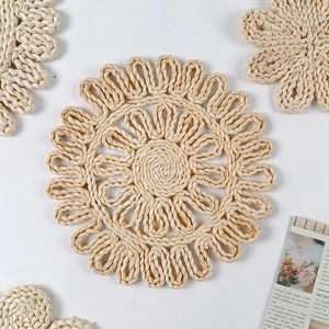Handwoven sunflower shaped corn husk placemats in natural beige for heat resistant table decor