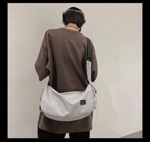 Light grey nylon yoga bag on model back showing large capacity and sport style